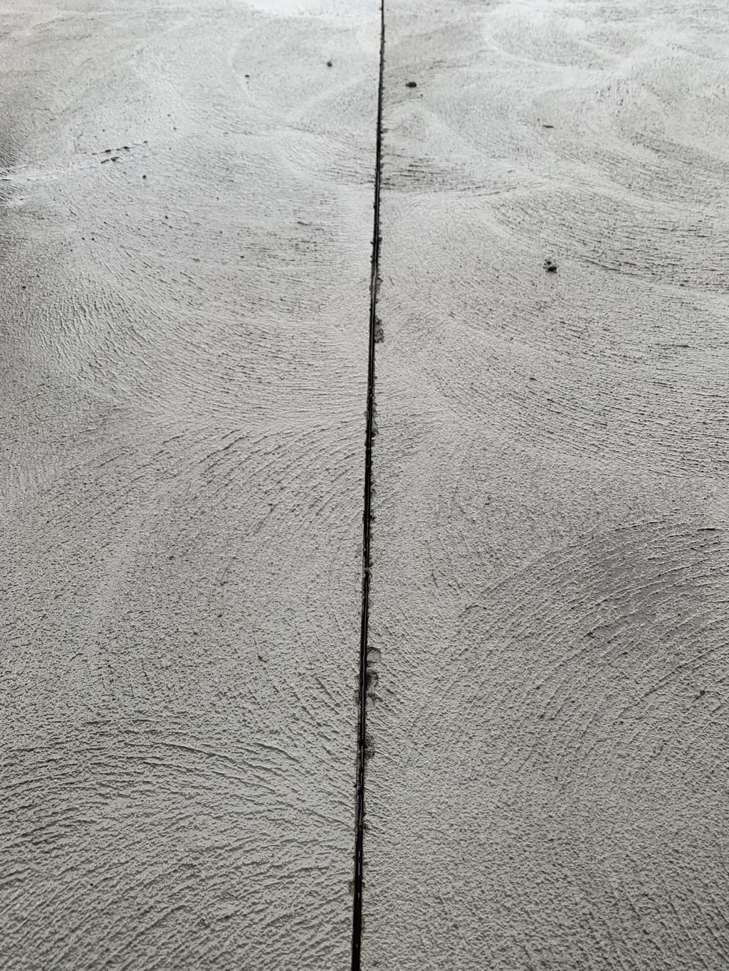 Clean control joint cut into a concrete slab